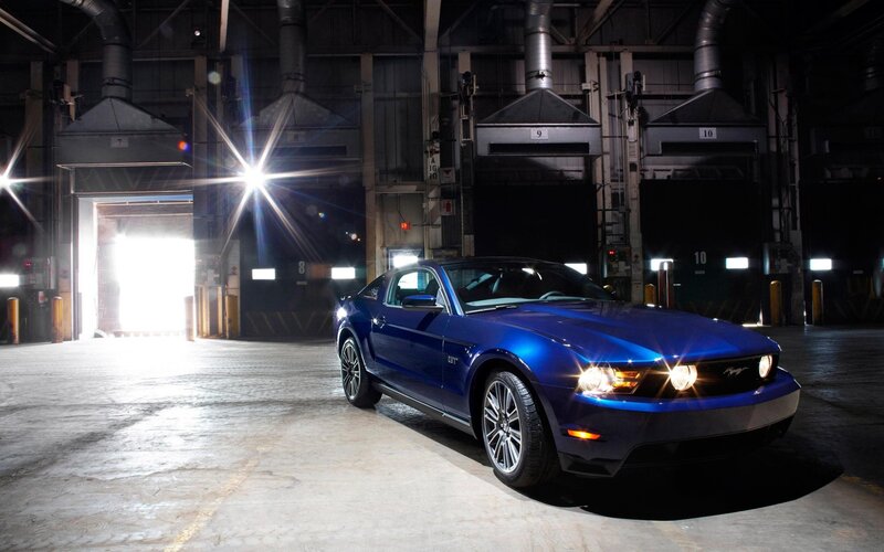 Blue Ford Mustang GT in warehouse
