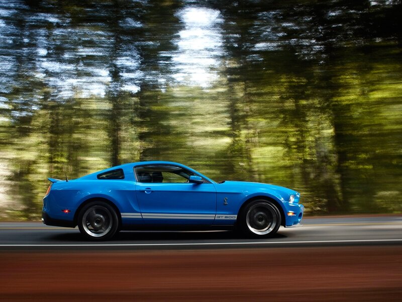 Blue Ford Mustang GT500 in motion