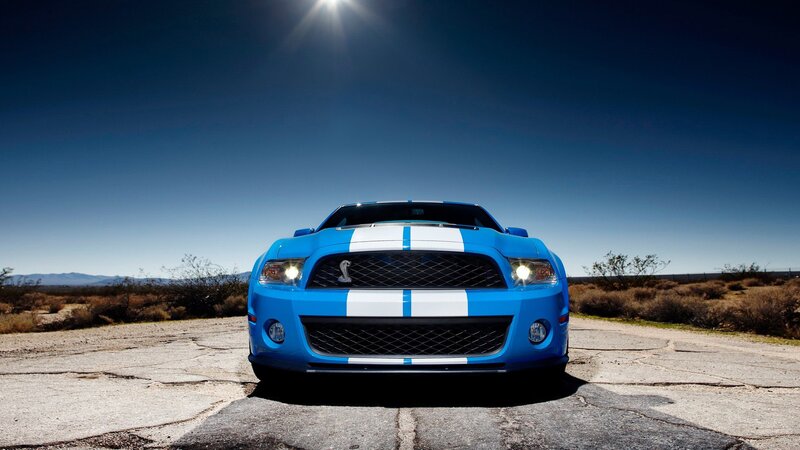 Blue Ford Mustang in desert