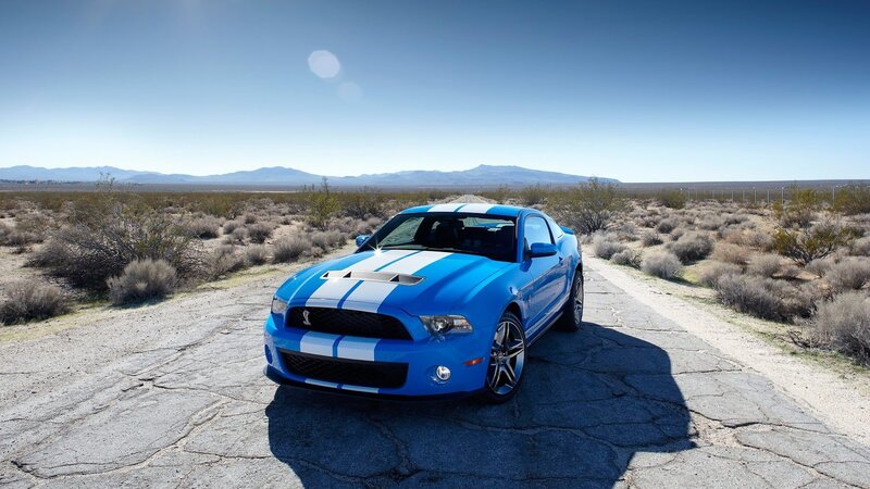 Blue Ford Mustang in desert