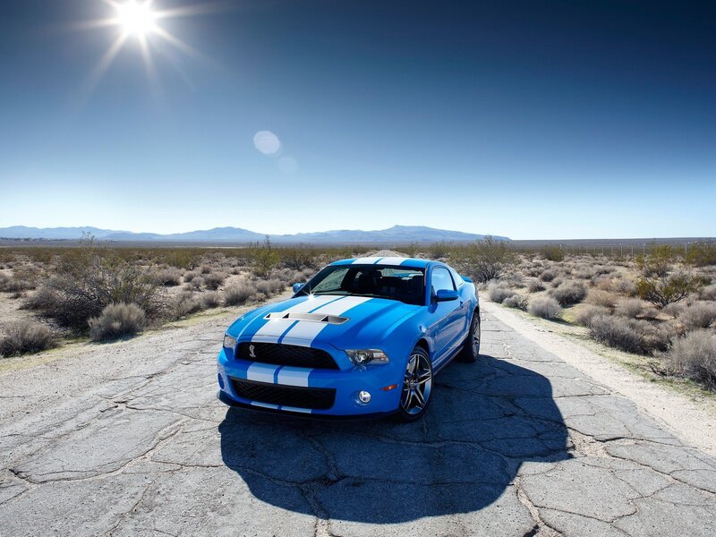 Blue Ford Mustang in desert