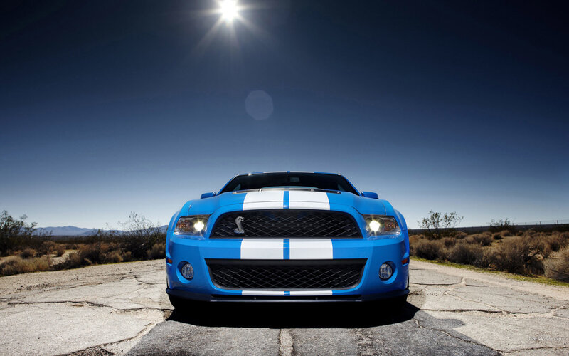 Blue Ford Mustang in desert