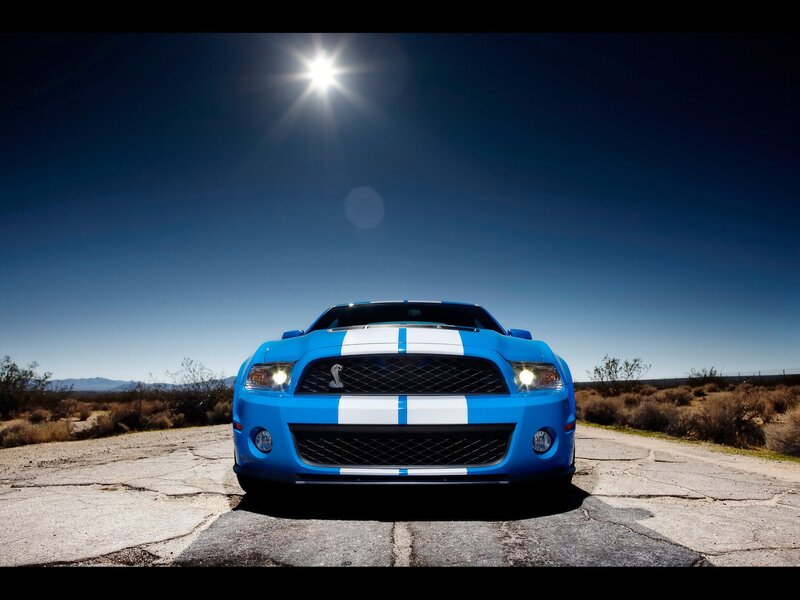 Blue Ford Mustang in desert