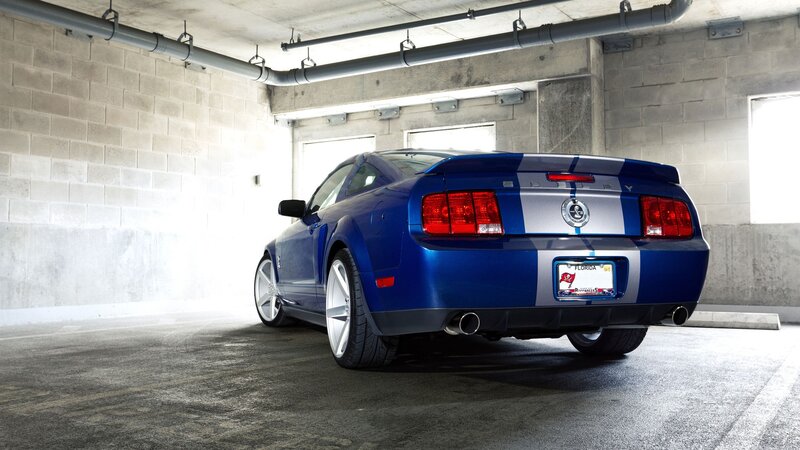 Blue Ford Mustang in garage