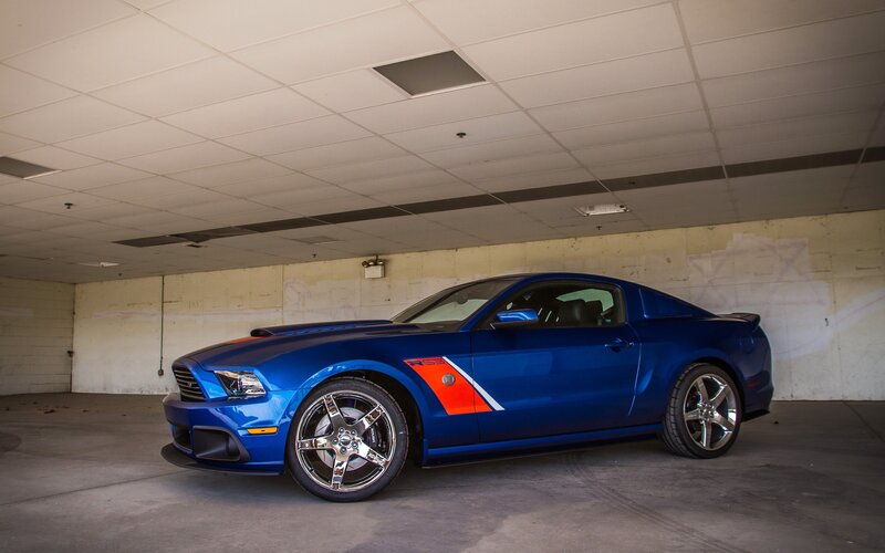 blue ford mustang in garage
