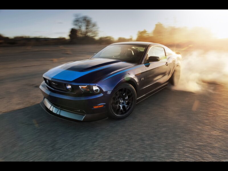 Blue Ford Mustang in motion