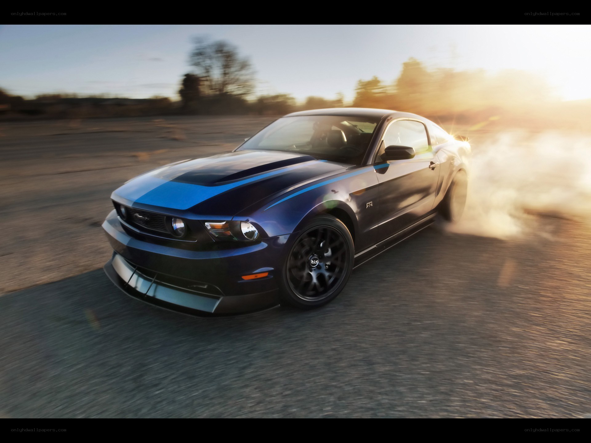 Blue Ford Mustang in motion