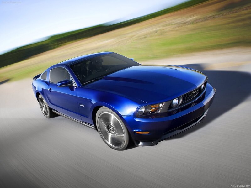 blue ford mustang in motion