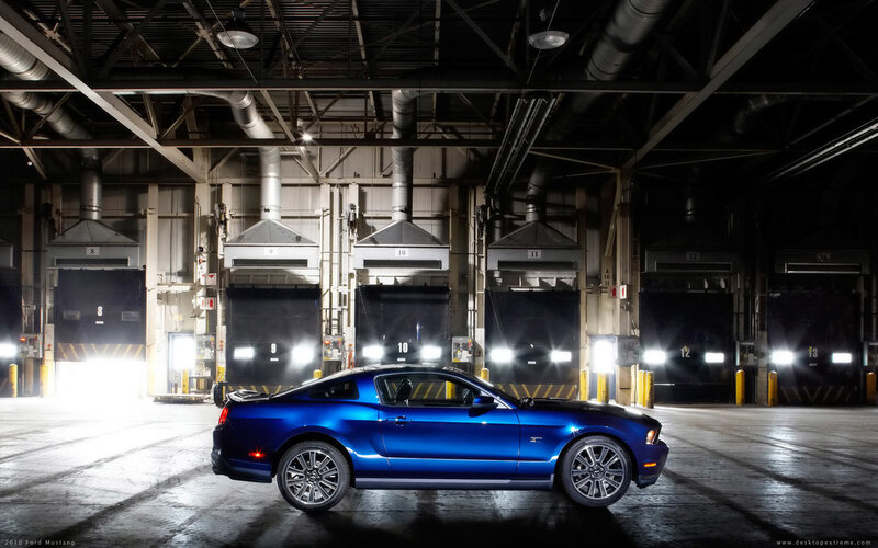 Blue Ford Mustang in warehouse