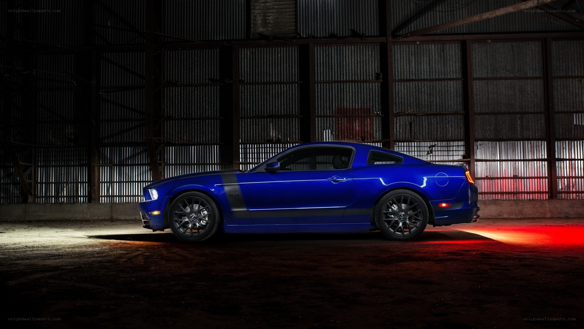 Blue Ford Mustang in warehouse
