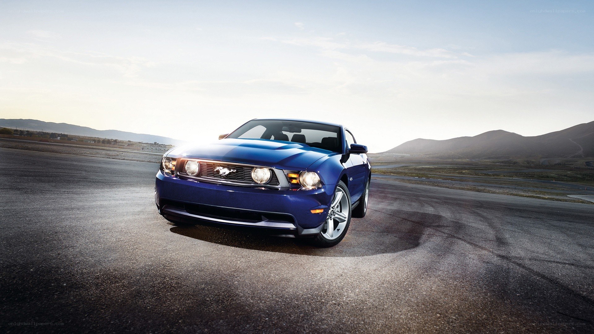 Blue Ford Mustang on a racetrack