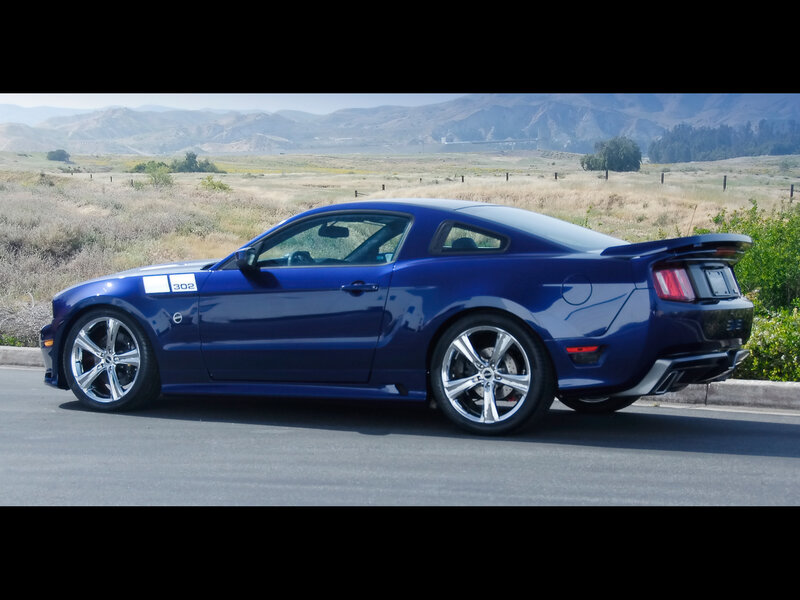 Blue Ford Mustang on a road