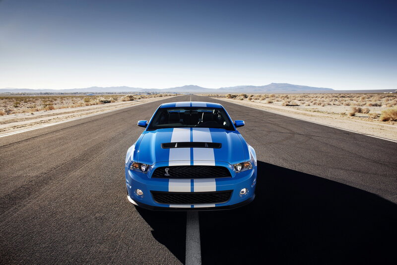 Blue Ford Mustang on desert road