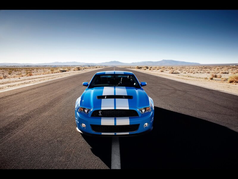 Blue Ford Mustang on desert road