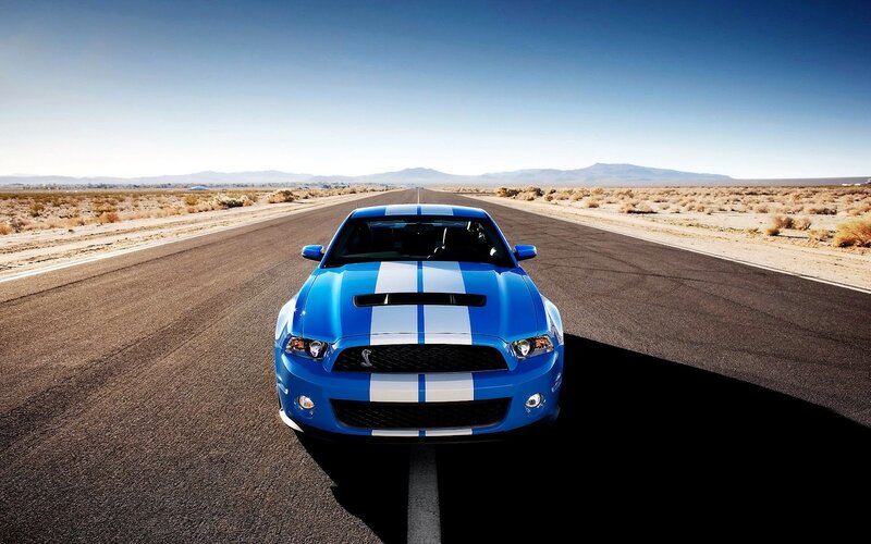 Blue Ford Mustang on desert road