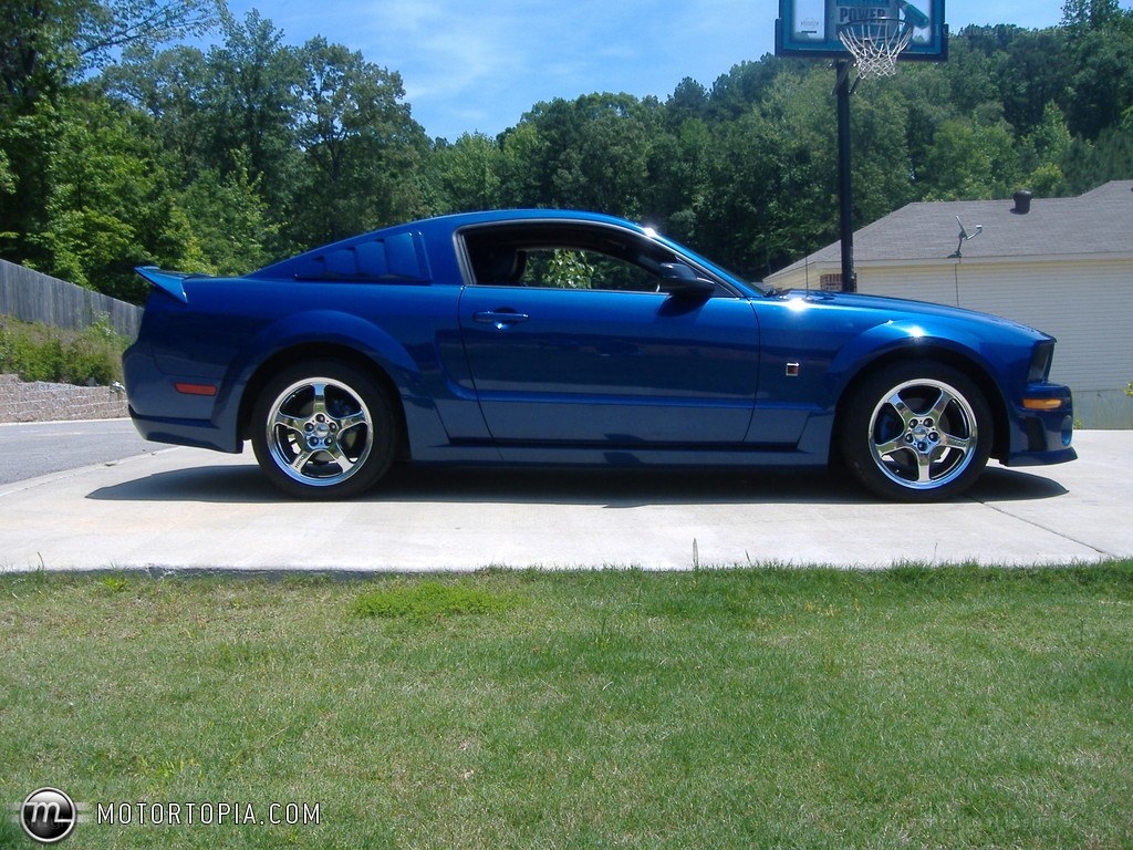 Blue Ford Mustang on driveway
