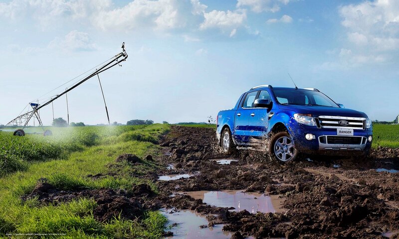 Blue Ford Ranger in muddy field