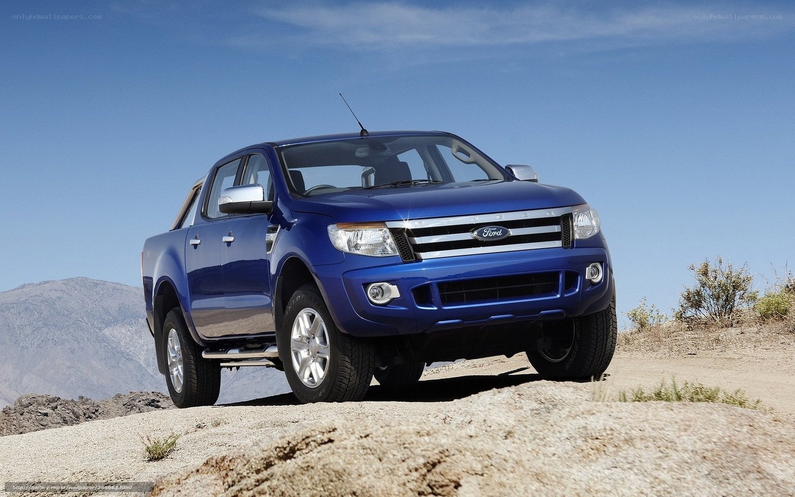 Blue Ford Ranger on a rocky hill