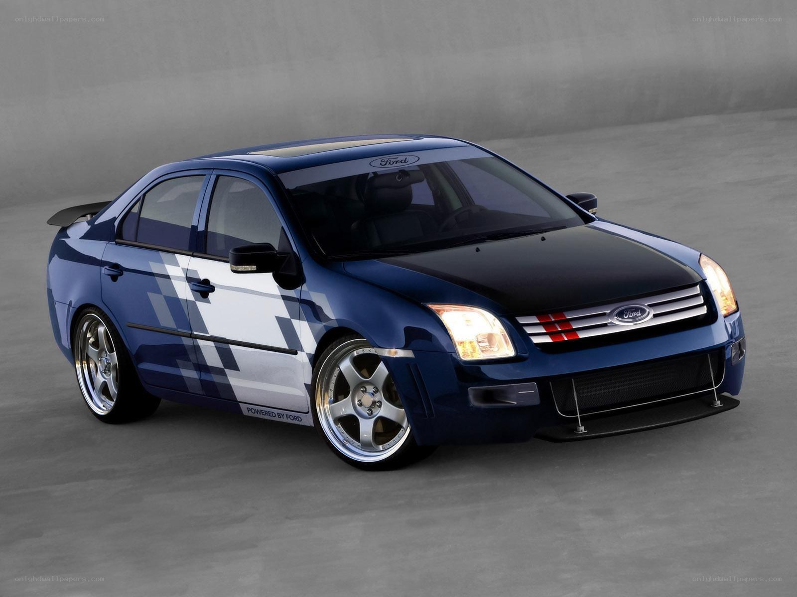blue ford sedan with racing decals