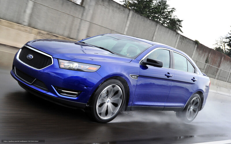 blue ford taurus in motion