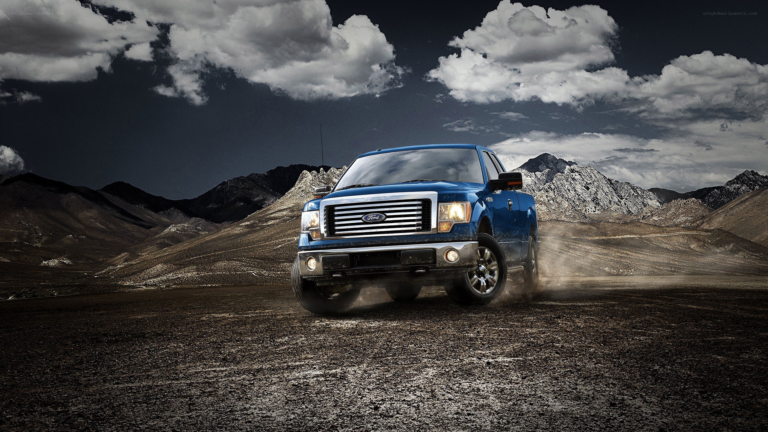 Blue Ford truck in desert
