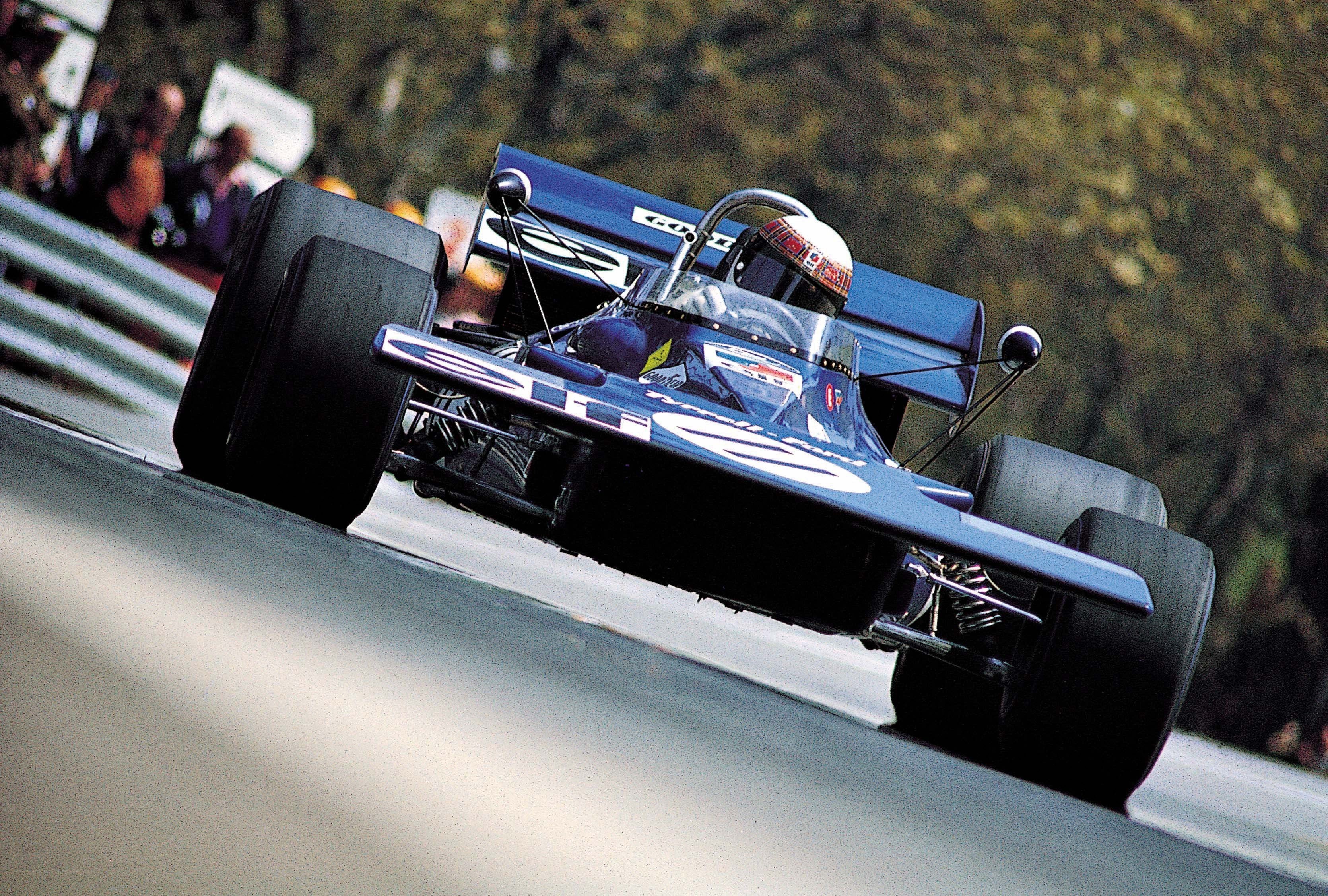 blue formula one car on track