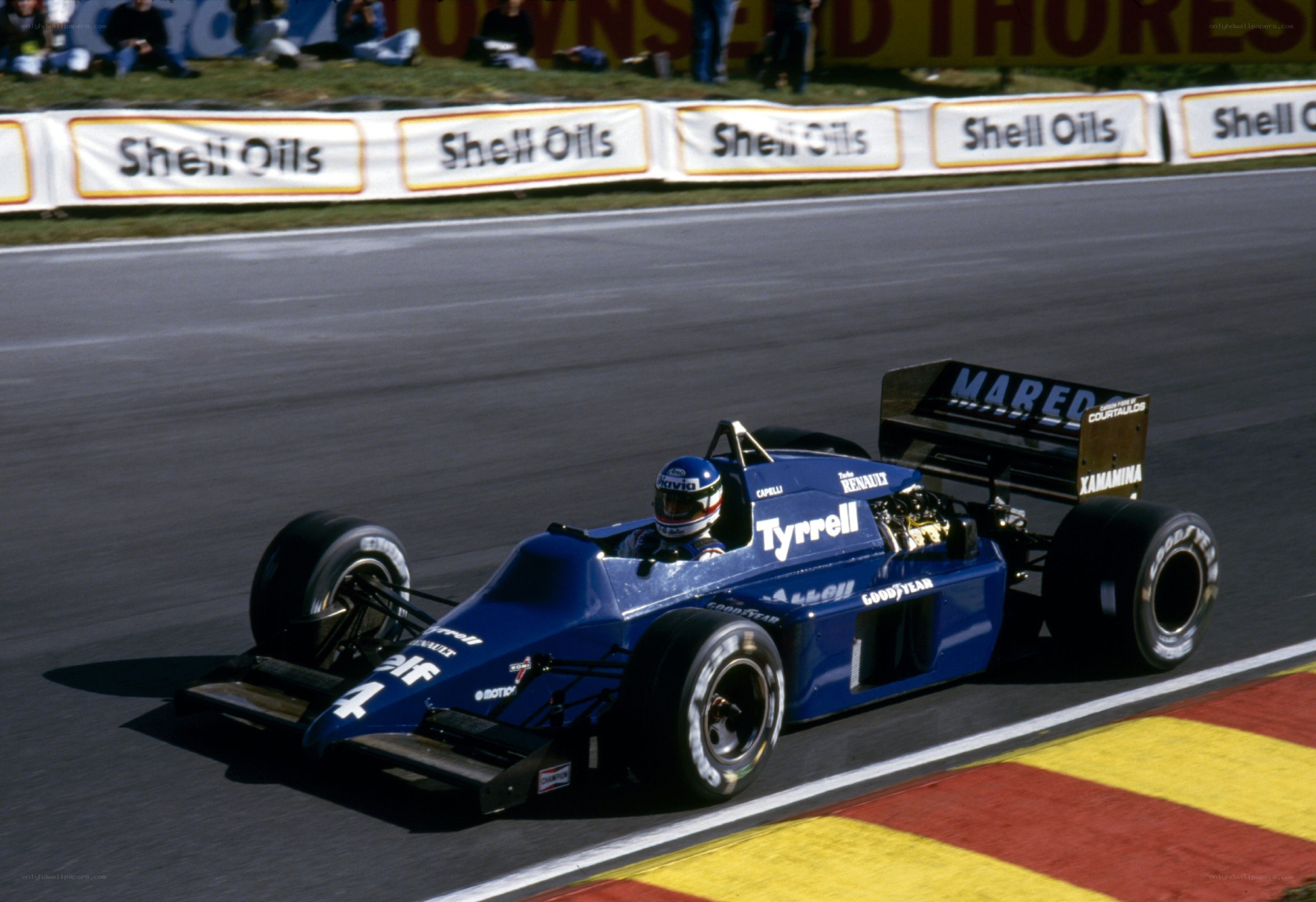 blue formula one car on track