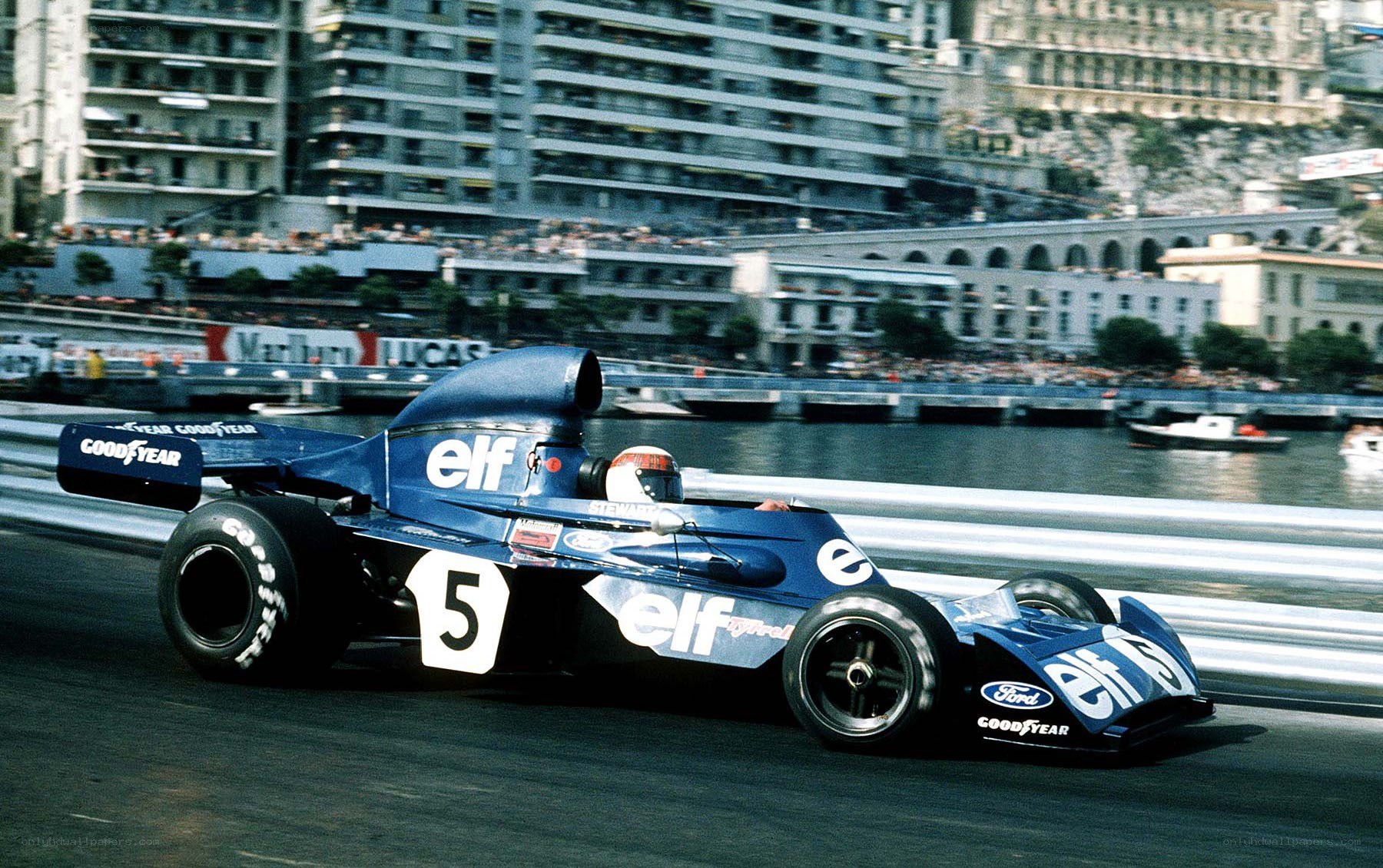 Blue Formula One car on track