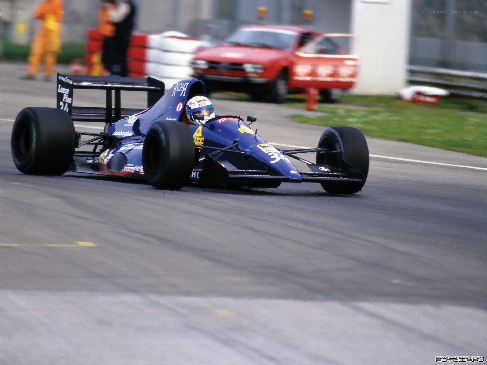 blue formula one car on track