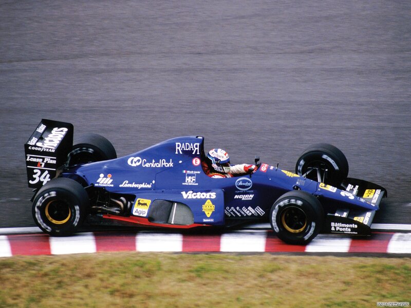 blue formula one car on track