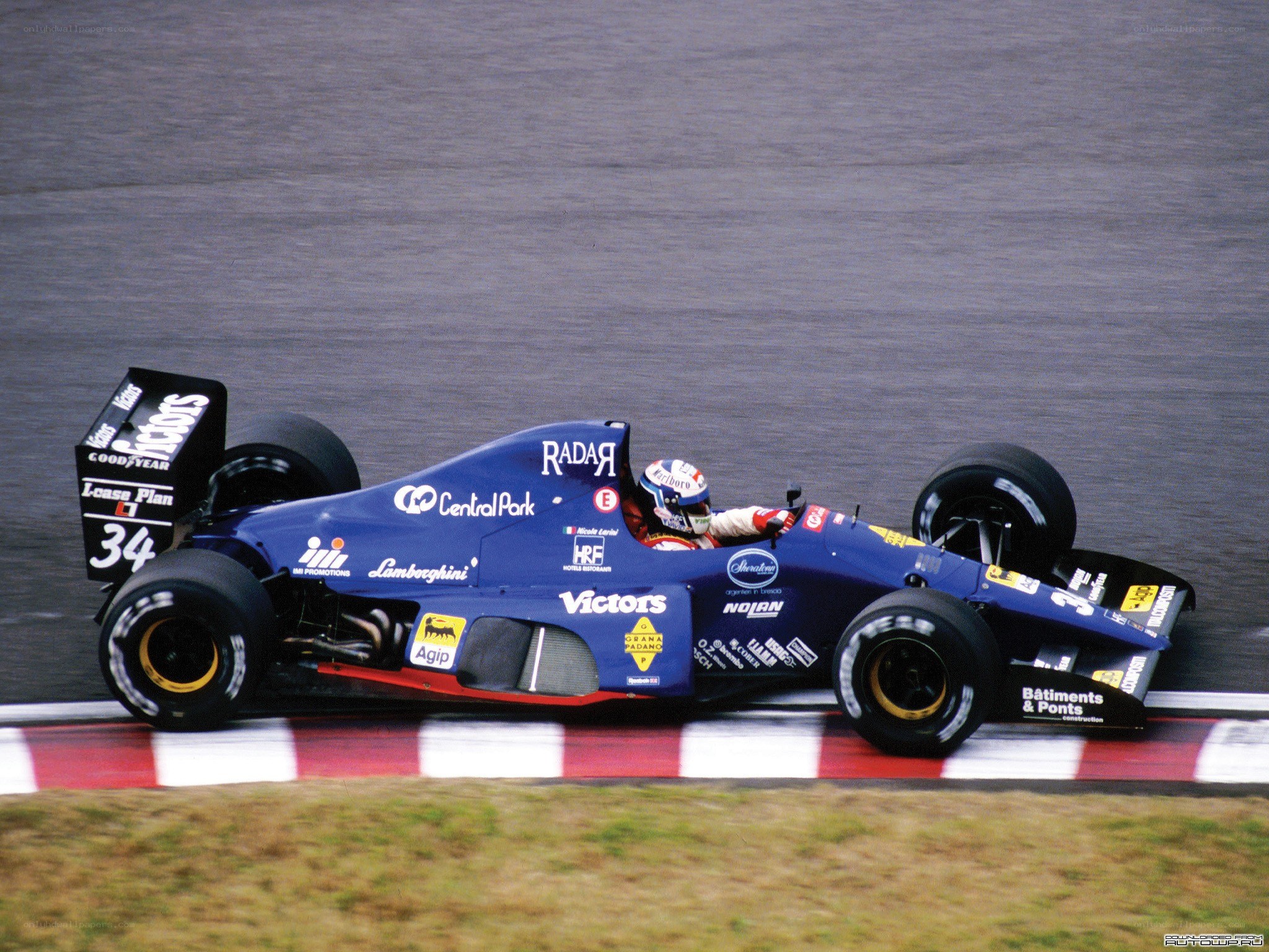 blue formula one car on track