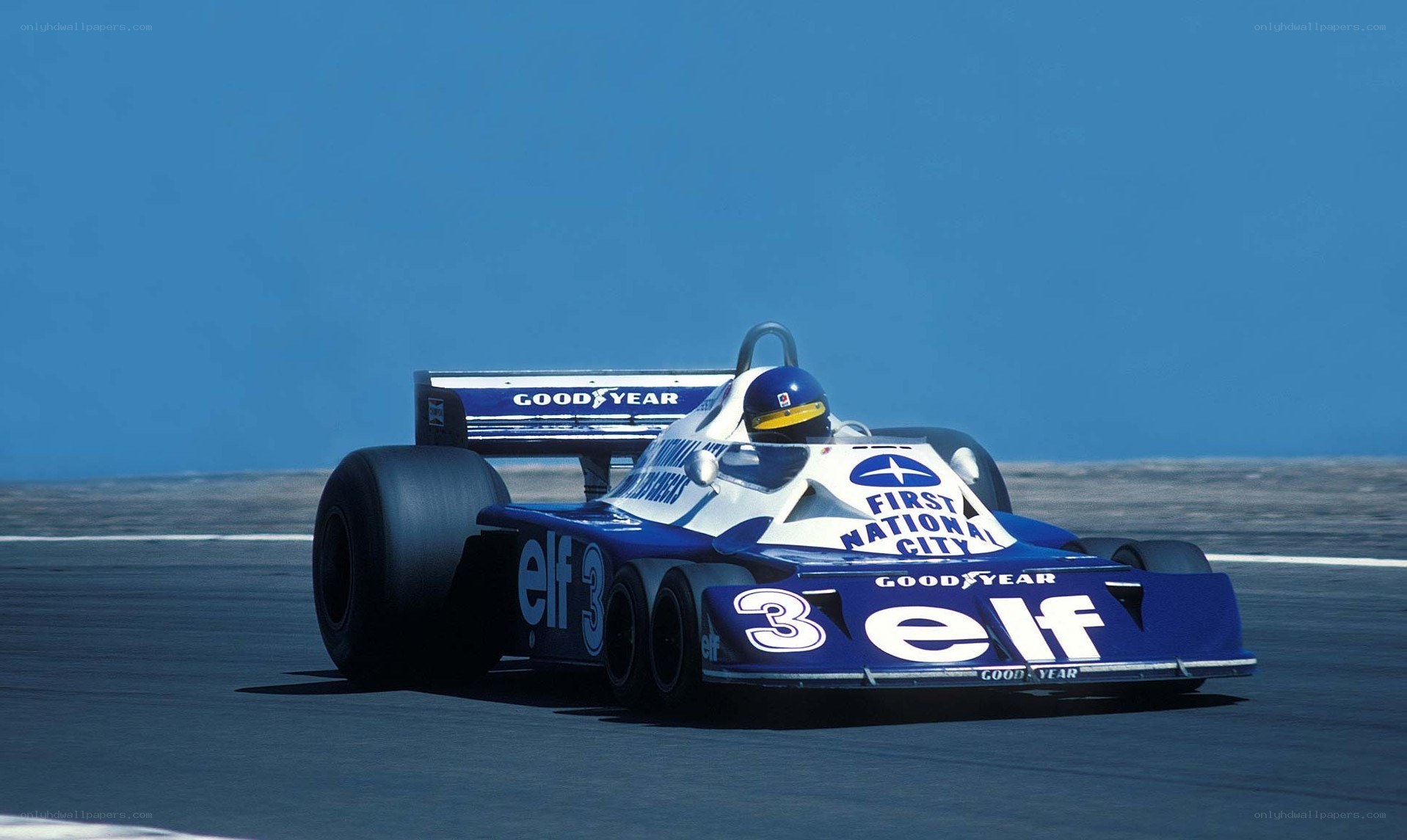 Blue Formula One race car on track