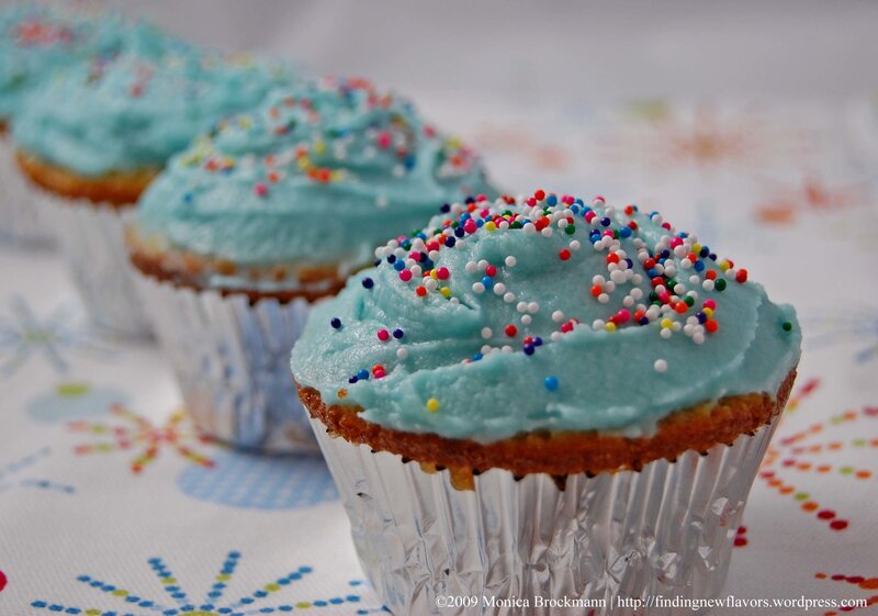 Blue-frosted cupcakes with sprinkles
