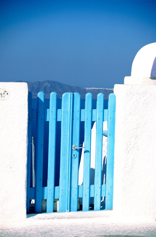 Blue gate with white walls