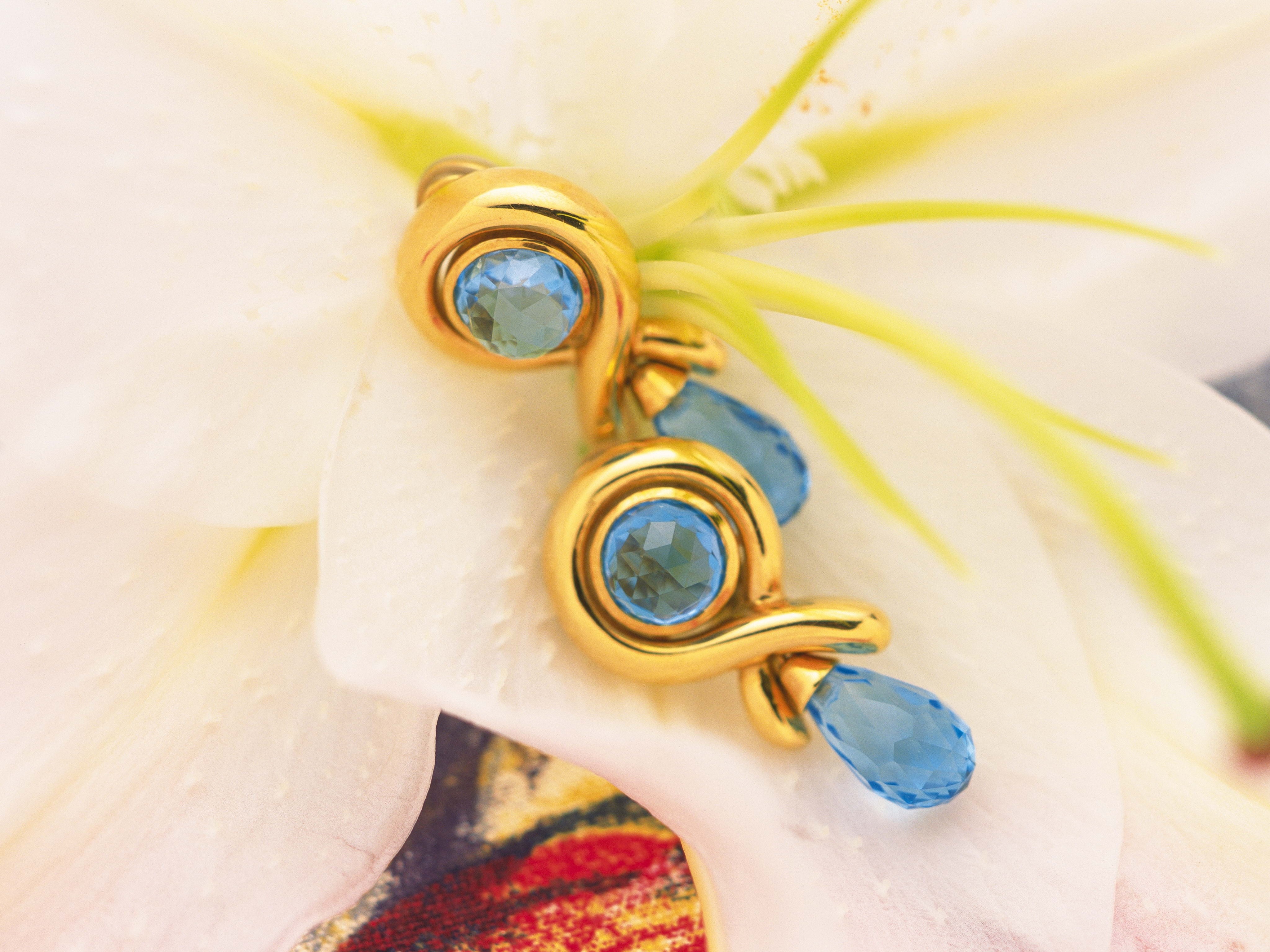 Blue gemstone earrings on flower