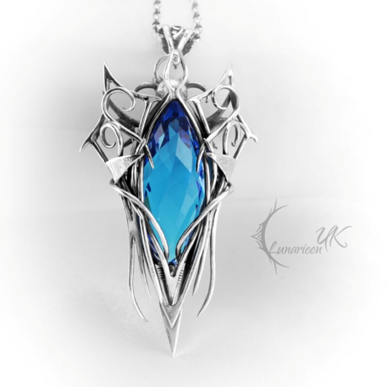 Blue Gemstone Pendant — Dramatic, Photograph