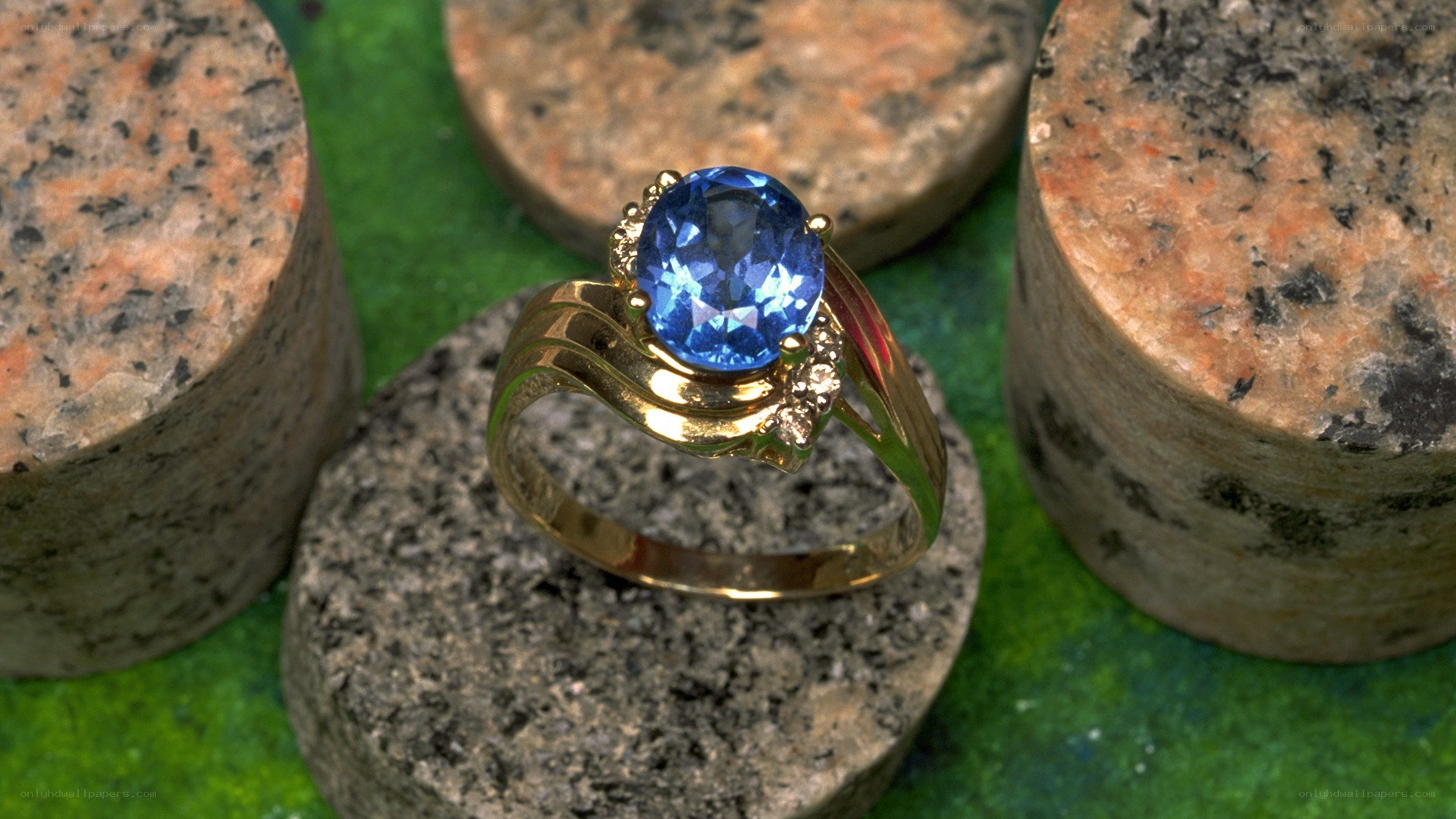 Blue gemstone ring on stone