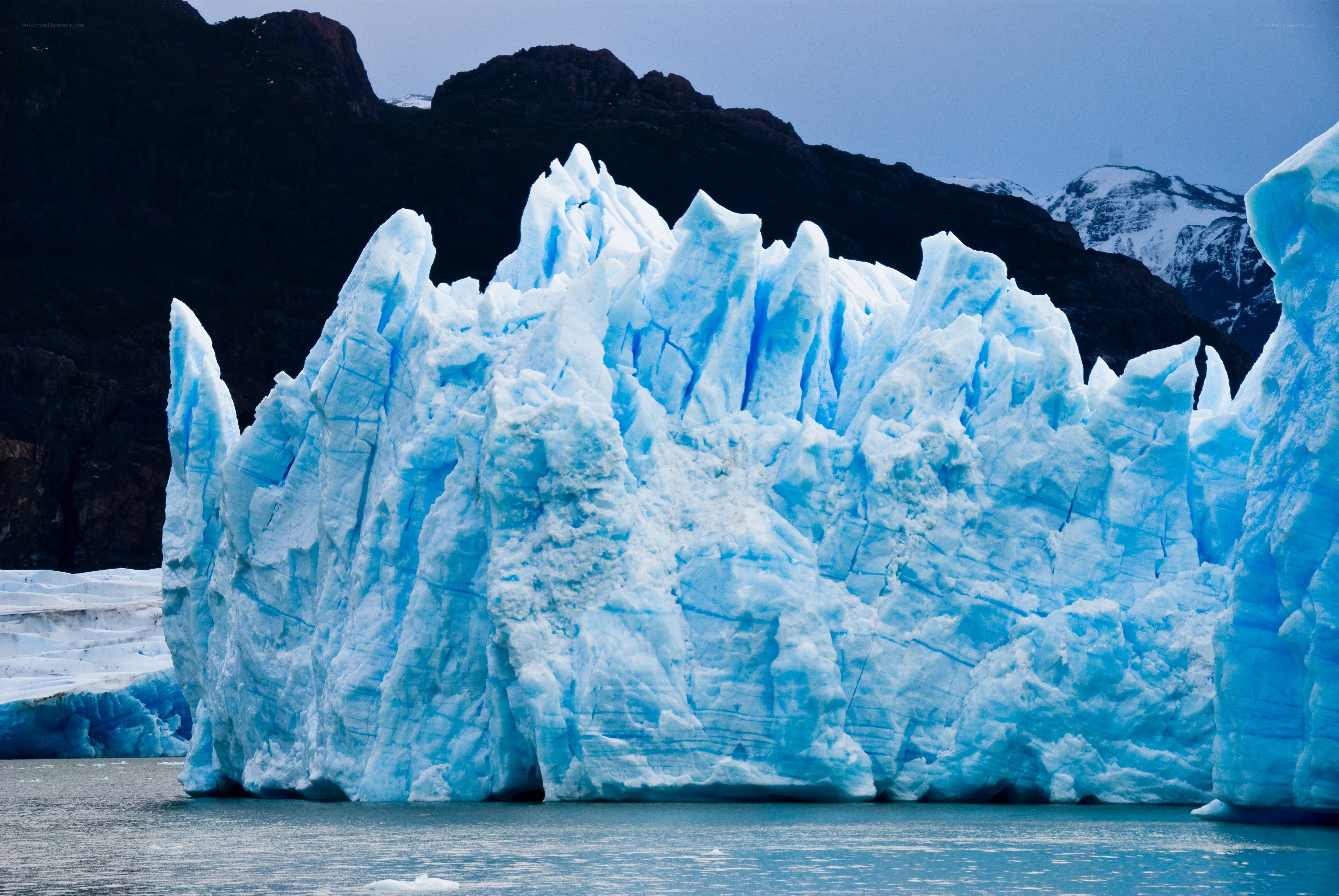 Blue glacier in a mountainous landscape
