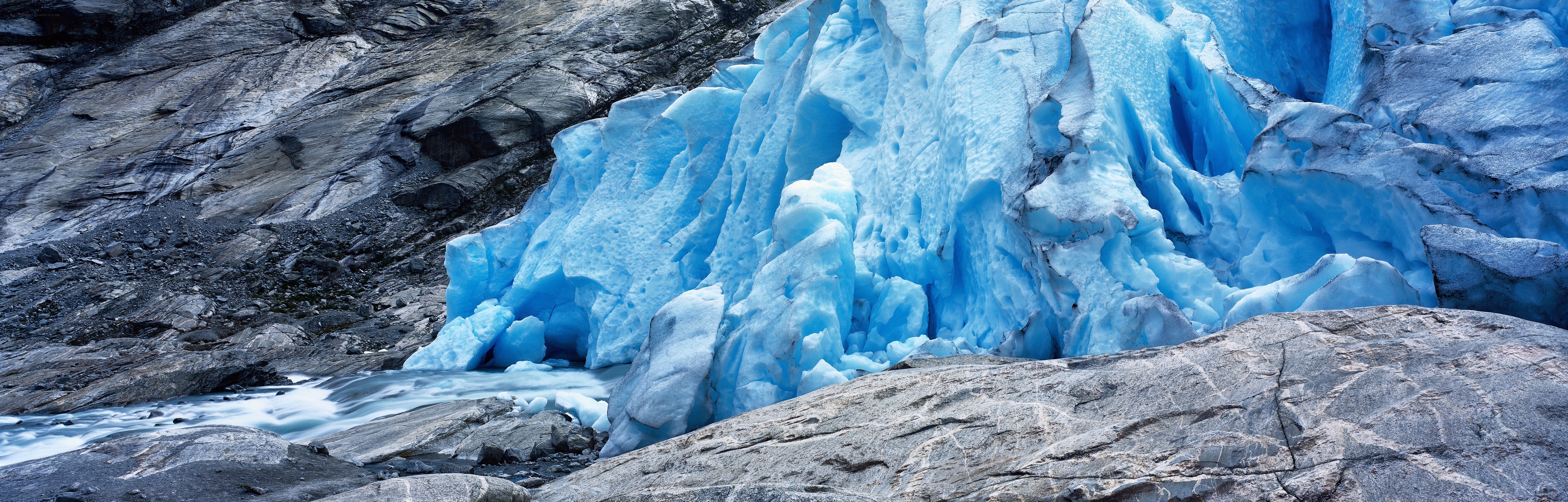 Blue glacier in rocky landscape