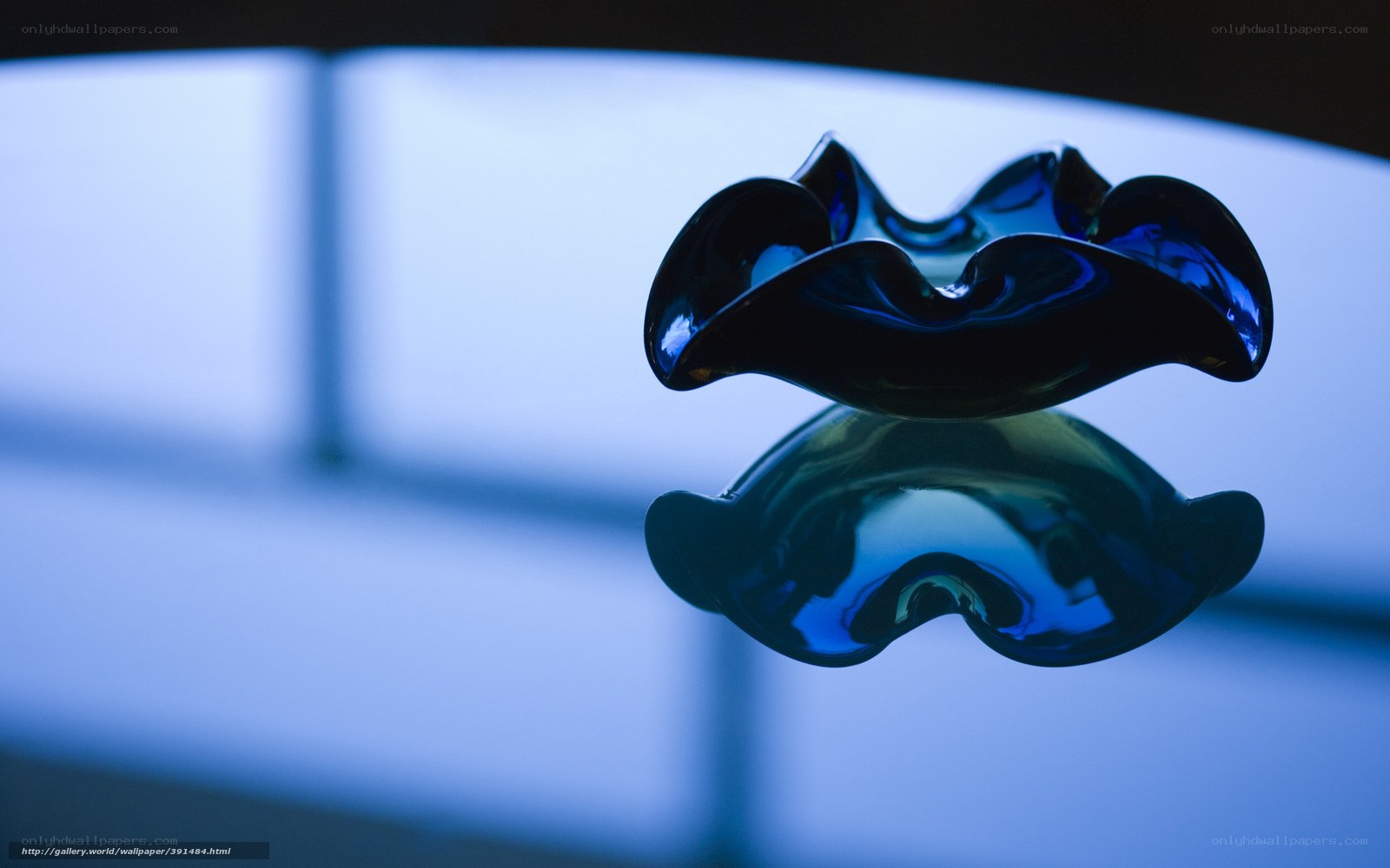 Blue glass sculpture reflection