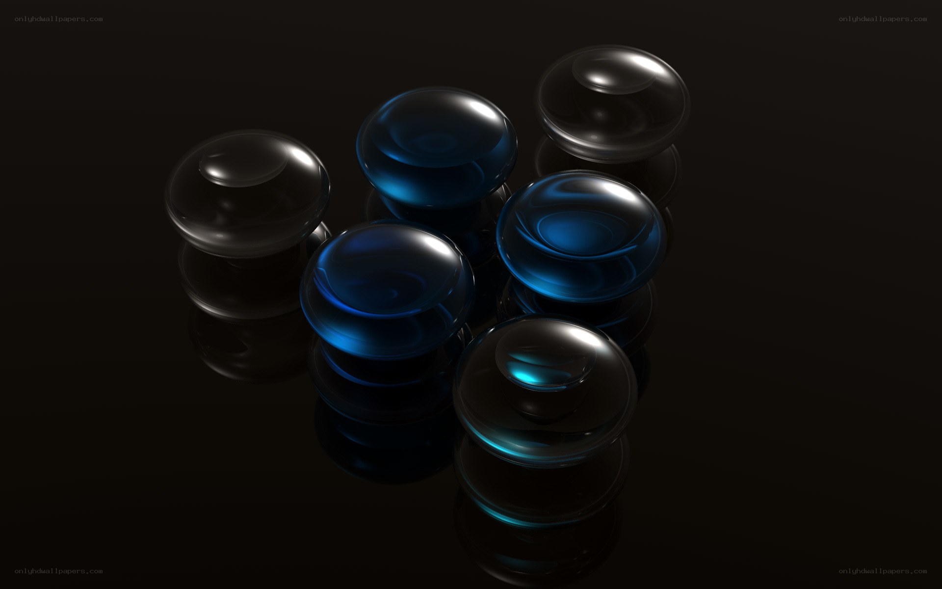 Blue glass spheres on black surface