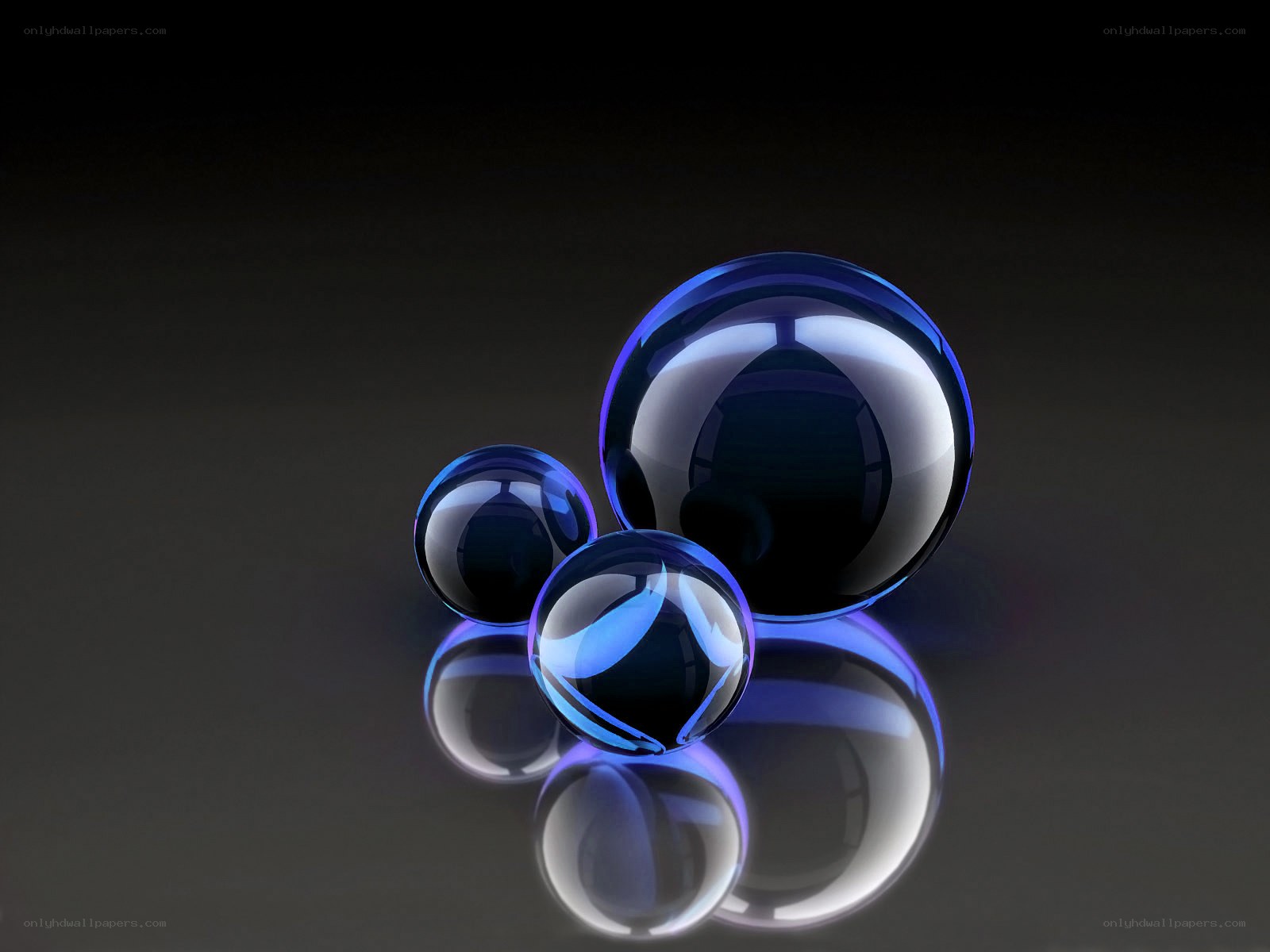 Blue glass spheres on dark surface