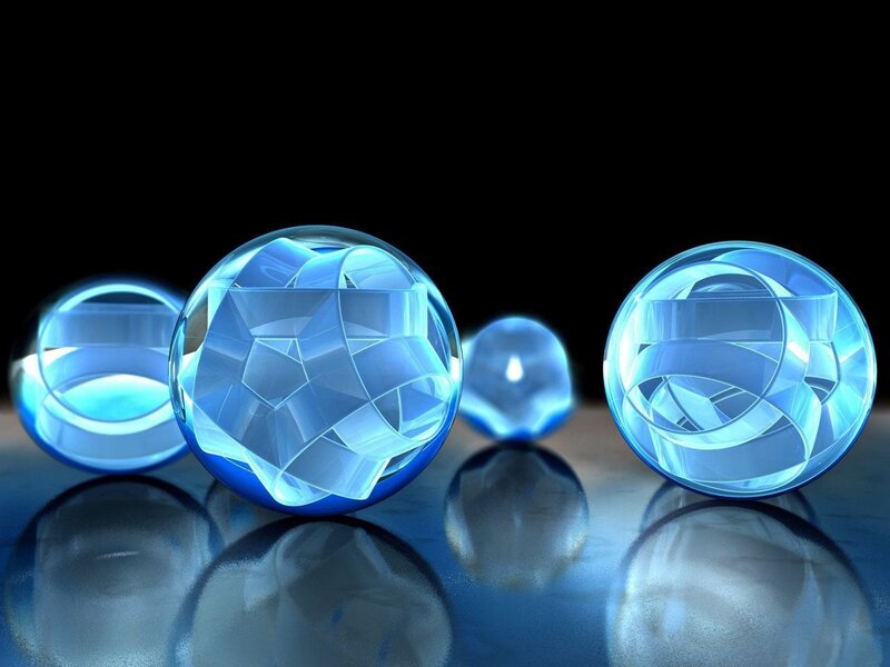 Blue glass spheres on reflective surface
