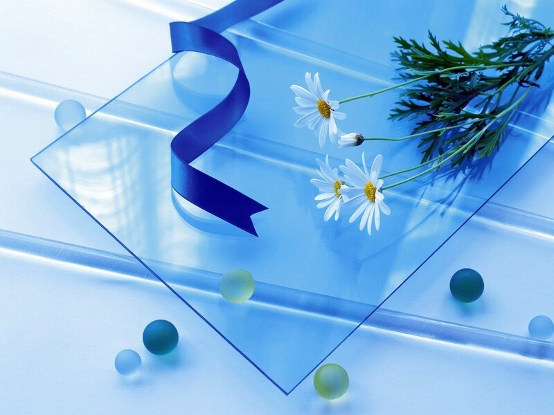 Blue glass with flowers and ribbon