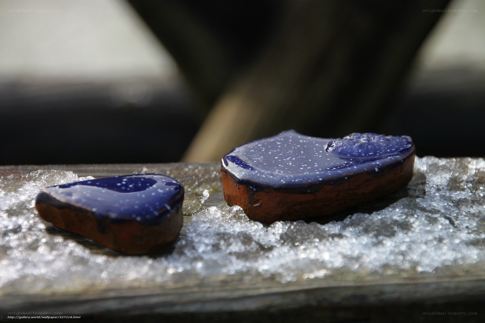 Blue-glazed ceramic pieces on ice