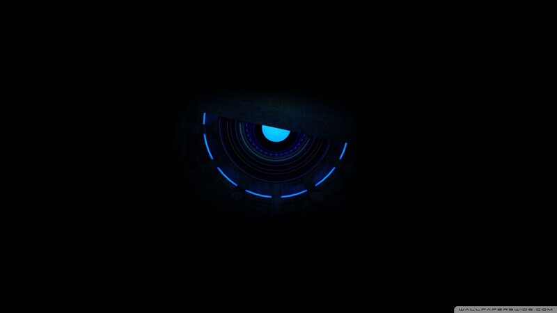 blue glowing eye in darkness