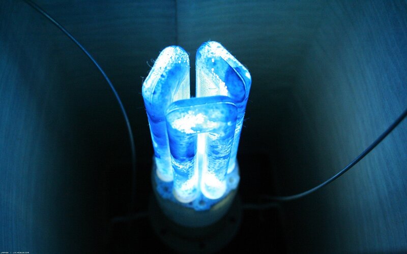 Blue Glowing Light Bulb — Dark