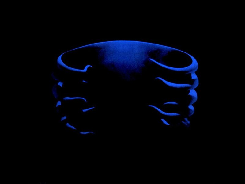 blue glowing ring on black