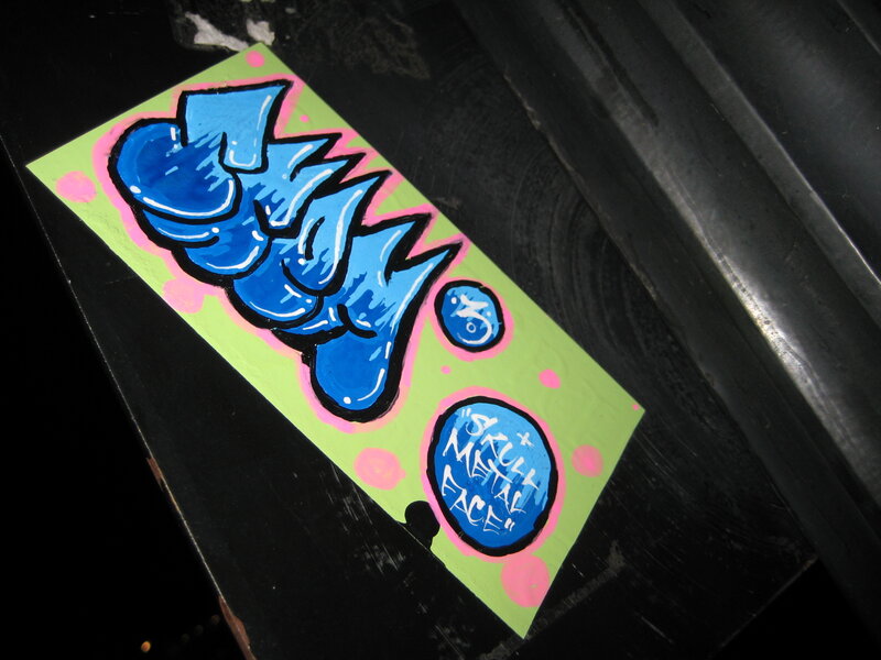 blue graffiti art on green background