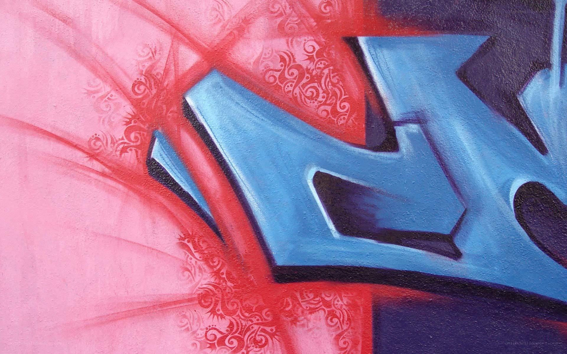 Blue graffiti letter on pink background